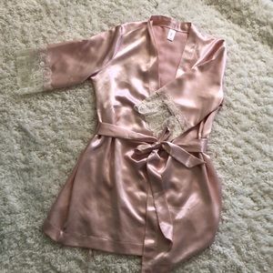 Light pink silk robe with lace sleeves.